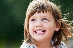 Smiling little girl outdoors